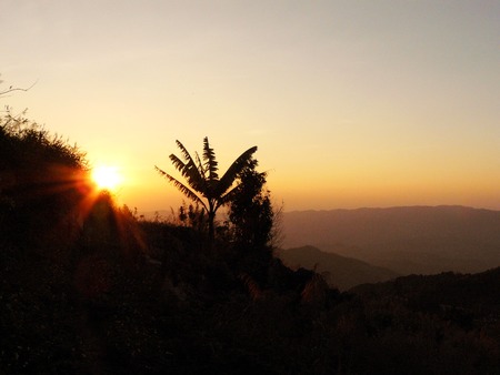Golden sunset view from mountain, The beautiful landscape scenery of the evening at Phataug the famous mountain in Chiang Rai province of Thailand.の写真素材
