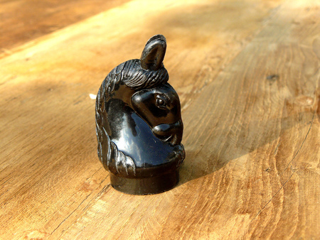 Thai's chess the wisdom game, Black knight horse on wooden table background.の写真素材