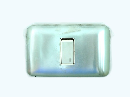 Electronic, light switch on the wall isolated on white background.