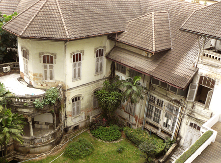 Photo of old Neo-Classic antique abandoned house. This place was old public park and old theater in Bangkok, now is a abandoned building and part of old public hospital. (This place is public domain)の写真素材