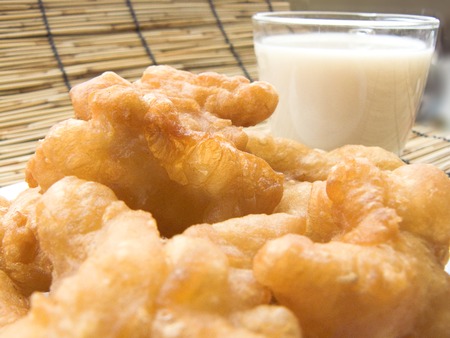 Delicious Asia, Asian eating food. Frying mini Chinese Churros or Chinese Donut in a wok for breakfast menu. The Thai name is Patongko.の写真素材