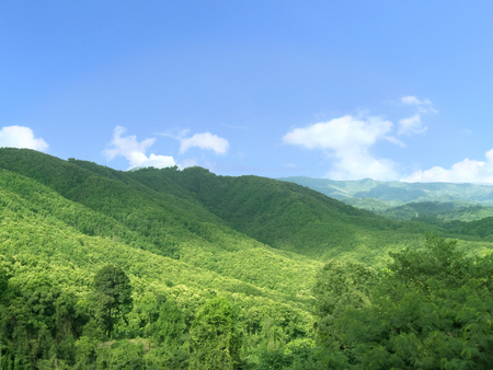 Beautiful natural, Landscape of green mountain range full of natural green forest and beautiful blue sky in a many clouds and sunlight of day Landscape..の写真素材