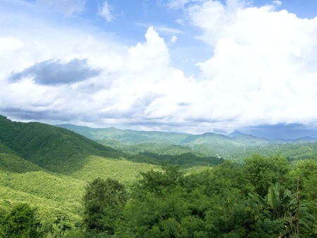 Beautiful natural, Landscape of green mountain range full of natural green forest and beautiful blue sky in a many clouds and sunlight of day Landscape..の写真素材