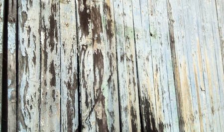 Old wooden texture of window behind the crack of color for background.の写真素材