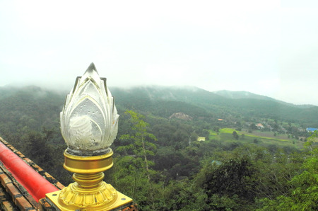 Lotus lantern glass of Thai's temple on top of the mountain, can see the other mountain standing in the mist. Lotus is a sign of Buddha for buddhists prayed to him.の写真素材