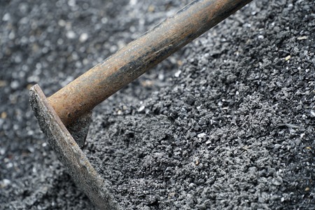 Hoe for construction process on a heap of rock.の写真素材