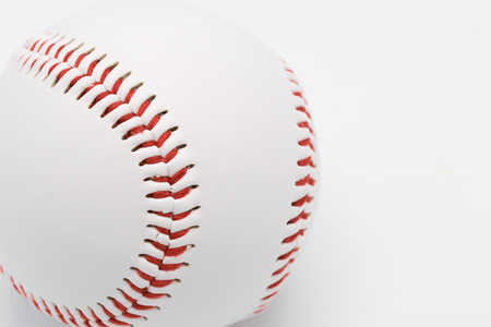 Isolated baseball on a white background and red stitching baseball.の写真素材