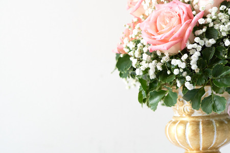 Red rose And pink beautifully arranged in a flower vase. Have romantic Decorate in important events such as wedding decoration in the building. And give it to the loved ones. copy space.の写真素材