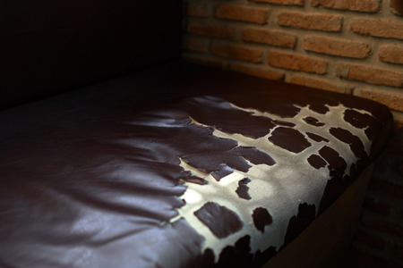 Dark brown leather sofa Long service life Damage caused by the use of the film. Hard to replace new leather seat. Caused by not care And unused applications.の写真素材