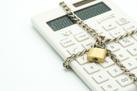 Lock and chain lock, white calculator, lock concept, financial account, bank account, white space, add text message, Can not be financially motivated Calculationsの写真素材
