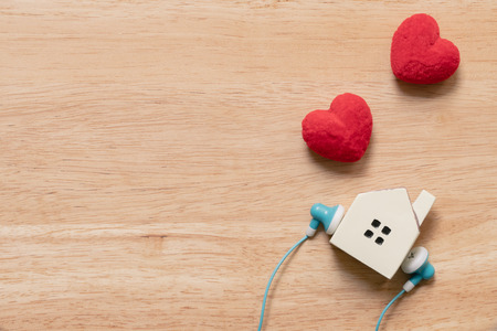 Couple Heart shaped and model house model. Red heart is the promise of love.  as background...