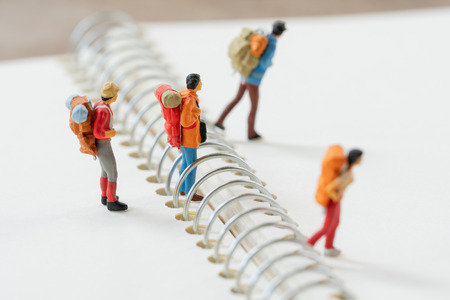 Miniature 2 people stand on The walkway the beginning of the journey To reach the goal. using as background  travel concept with copy spaces for yourの写真素材