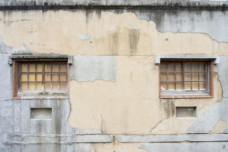 Windows and walls Old house with cracks The window and the wall of the house is a religious style according to the oriental style. Chinese mixed Japaneseの写真素材