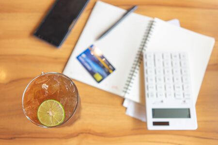 Flat lay of top view office table desk with Calendar, calculators pens and other office supplies as background Workspace and Comfortable work table concept with copy space.の写真素材