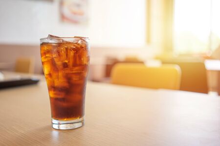Glass of soft drinks placed on the table gives a refreshing feeling when drinking with mixed sugar and caffeine. with copy spaces.の写真素材