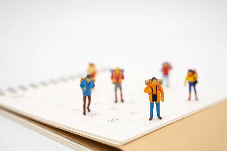 Miniature people stand on The walkway the beginning of the journey To reach the goal. using as background  travel concept with copy spaces for yourの写真素材