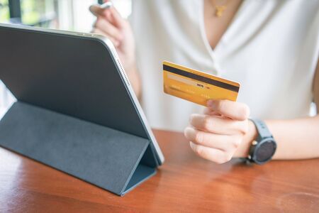 Online shopping with smartphone and shopping bags delivery service using as background shopping...