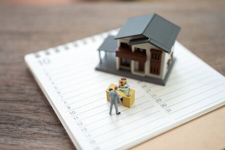 Miniature people businessmen analyze standing on a Book Rankings (list). using as background business concept with copy space and white space for your text or  design.の写真素材