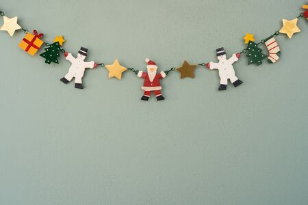 Christmas frame background with decorations and gift boxes on green background. Christmas wallpaper, winter, new year concept. Flat lay, top view, copy spaceの写真素材