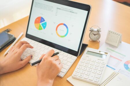 Young Freelancer or Businessman working at home office and typing on keyboard smartphone tablet. Working Online Or Studying And Learning While Using smartphone tablet. Freelance Work, Business conceptの写真素材