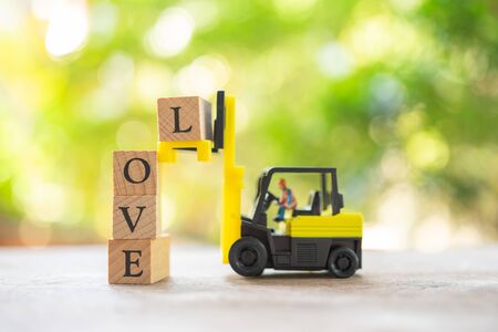 Miniature people Construction worker with wood word LOVE. Day 14 meets Valentine Day. using as background Valentine concept with copy spaces for youの写真素材