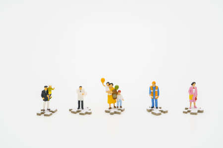 Social distancing. Miniature people stay apart to reduce Covid 19 virus infection. Maintain social distance Detained, could not find anyone. using as background Healthcare concept and keep distance.の写真素材