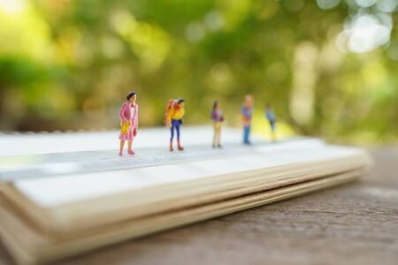 Social distancing. Miniature people stay apart to reduce Covid 19 virus infection. Maintain social distance Detained, could not find anyone. using as background Healthcare concept and keep distance.の写真素材