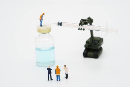 Miniature people Doctor researcher and vaccine developer for Covid 19 viruses or coronavirus .using as background Healthcare concept and Medical concept with copy space.の写真素材