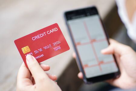 Online shopping with smartphone and shopping bags delivery service using as background shopping concept and delivery service concept with copy space  for your text or  design.の写真素材