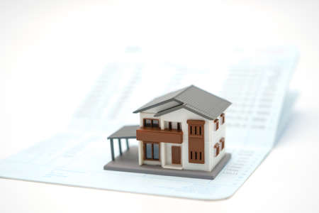 The house model is placed on bank notes. Investing in investment in real estate Home loan using as background business concept and real estate concept with copy space for your textの写真素材