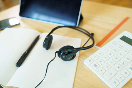 Headphones and school supplies Teleconference using lesson online course communicate by conference video call from home, e-learning education concept.の写真素材