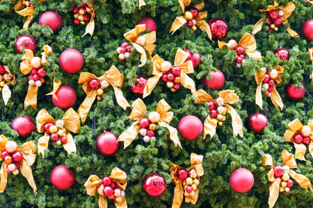 Decorated Christmas tree with fir tree on bakeh background. Merry Christmas and New Year holidays background with copy space for your textの写真素材
