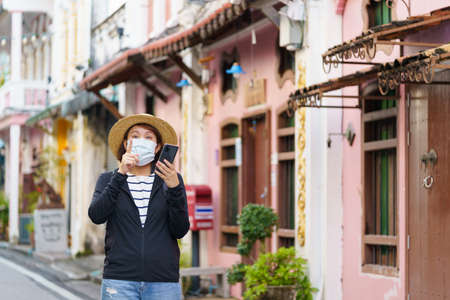 Travelers on street Phuket old town with Building Sino Portuguese architecture at Phuket Old Town area Phuket, Thailand. Travel conceptの写真素材