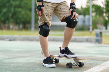 Surfers Asian man having fun with surfboards or surf skate around city streets background on a summer day. Free relax lifestyle and millennial trend conceptの写真素材