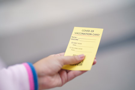 Passport with vaccination certificate for COVID-19 person record card. Immune passport or certificate for Get vaccinated before travel. Vaccination, disease immunity passportの写真素材