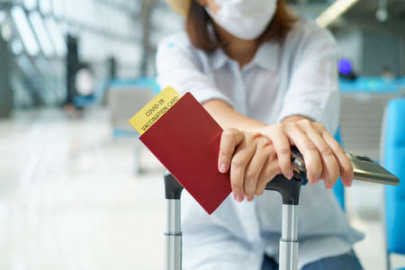 Passport with vaccination certificate for COVID-19 person record card. Immune passport or...