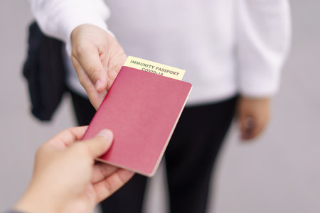 Passport with vaccination certificate for COVID-19 person record card. Immune passport or certificate for Get vaccinated before travel. Vaccination, disease immunity passportの写真素材