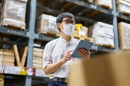 Portrait Asian men, staff, product counting Warehouse Control Manager Standing, counting and...