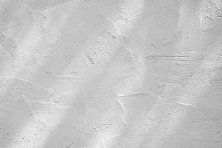 Loft-style plaster walls, gray, white, empty space used as wallpaper. Popular in home design or interior design. with copy spaces.の写真素材