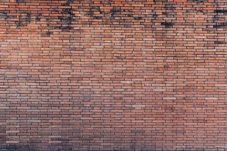 red brick wall texture grunge background. modern style background, industrial architecture detail display and montage of product. Interior design concept, background texture with copy spaces.の写真素材