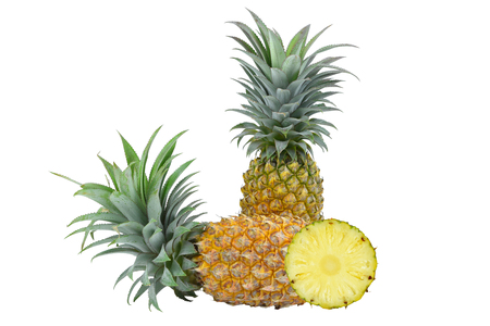 Two pineapples and pineapple slices on white background.の写真素材