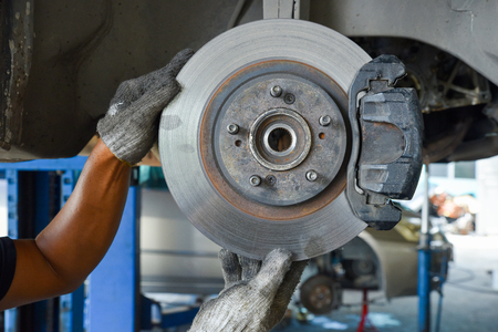 Mechanic check the car brake.の写真素材