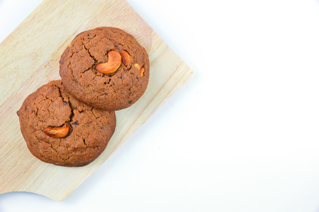 Cashews cookie on wooden boards and white background.Top view.の写真素材