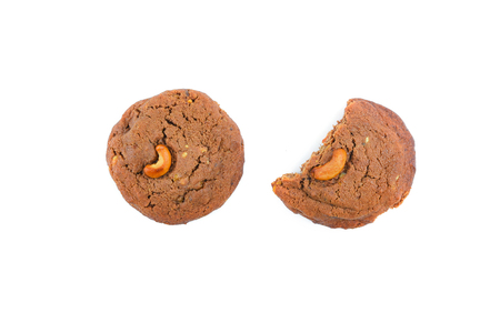 Bitten cashews cookie isolated on white background.Top view.の写真素材