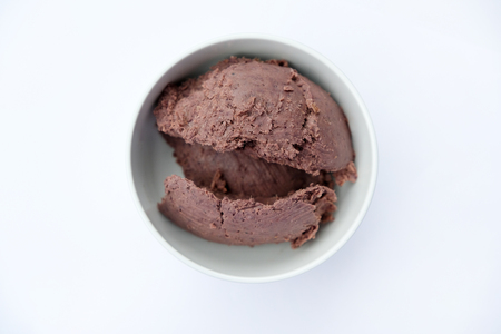 Shrimp paste in a white bowl top view isolated on white backgroundの写真素材