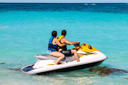 Man and woman on a jet skiの写真素材