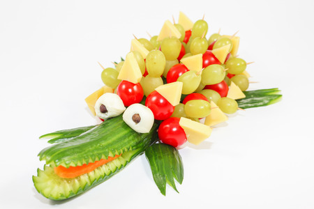 Cucumber crocodile - crocodile carved out of a cucumberの写真素材