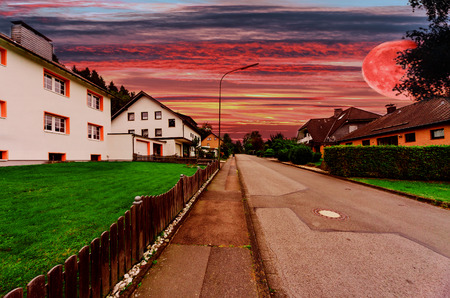 Village street with futuristic interplanetary skyの写真素材