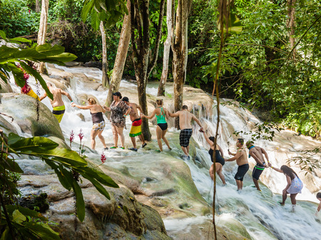 Ocho Rios, Jamaica - November 15, 2016: The Dunn's River Falls are waterfalls in Ocho Rios in Jamaica, which can be climbed by tourists.のeditorial素材