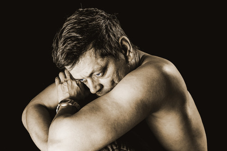 Pensive man with free upper bodyの写真素材